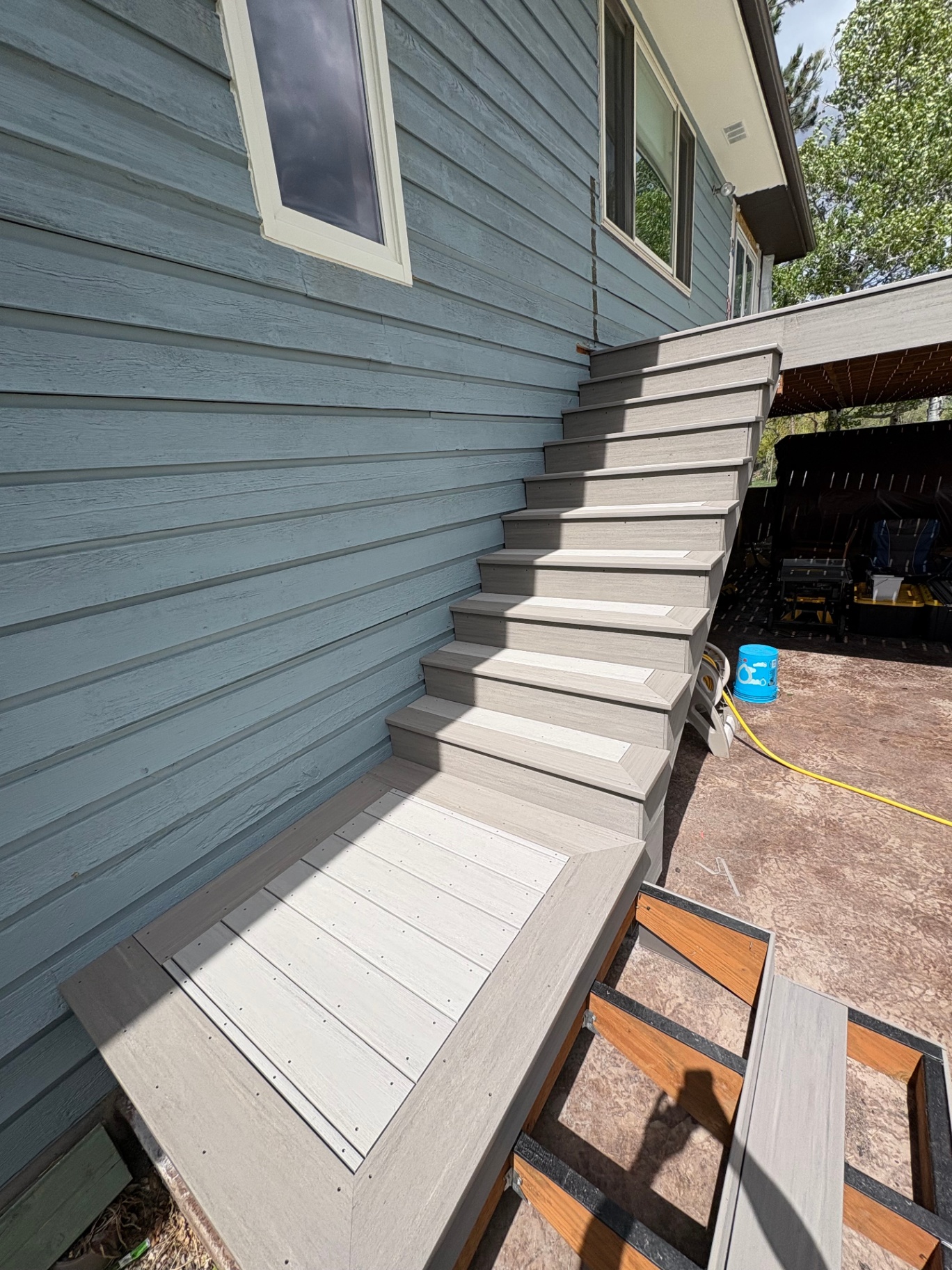 Composite wraparound staircase — Stairs & Extensions project in Shreveport by ARK LA TEX Entreprises