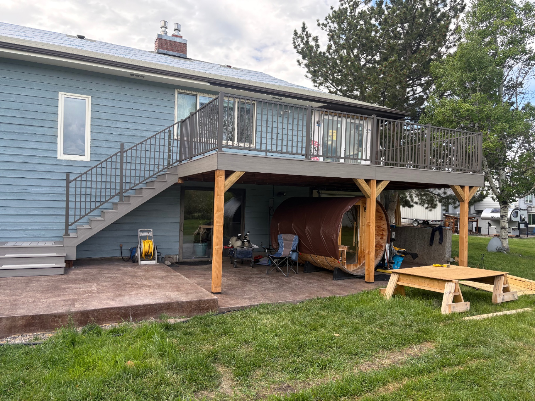 Two-story deck over stamped patio — New Decks project in Shreveport by ARK LA TEX Entreprises